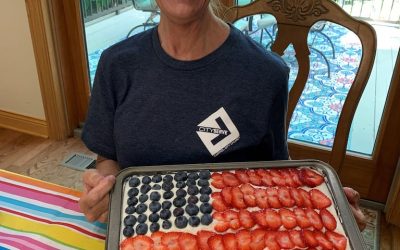 City Serve Team grilled up some tasty burgers along with baked beans, chips, and decorated flag cake.