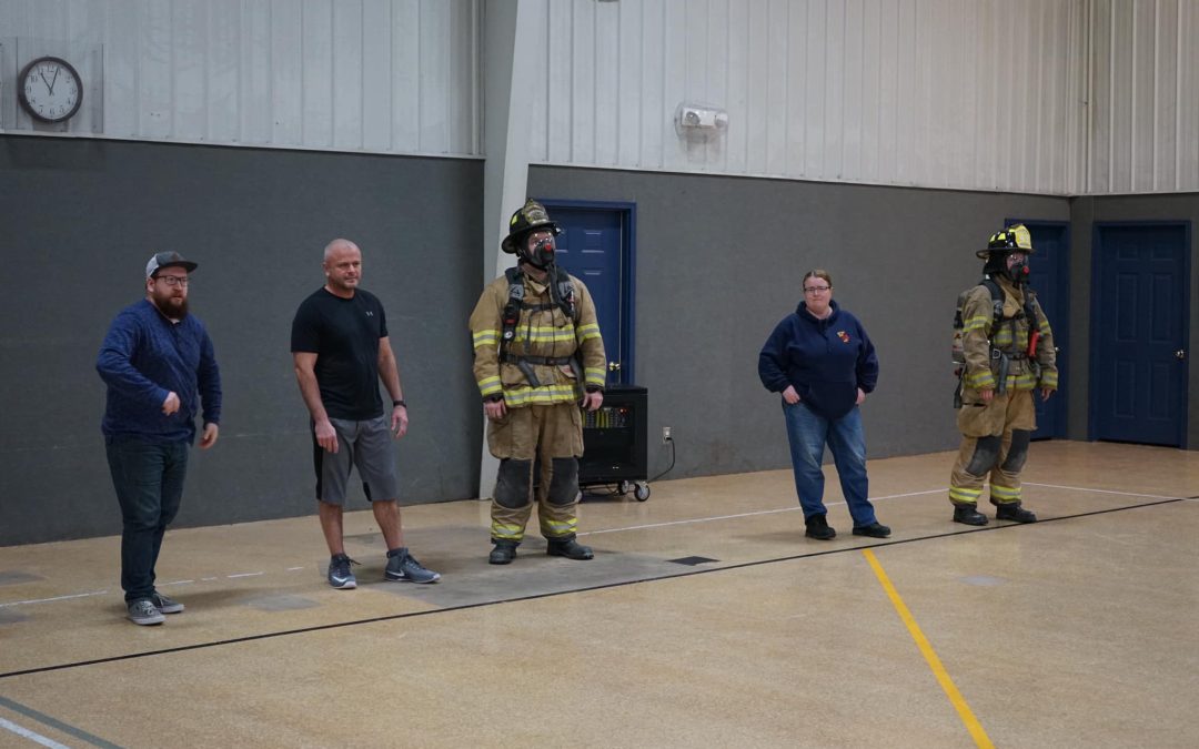 Saylor Township Fire Fighters work out by playing dodge ball In Full Gear with pastors and staff from Capitol City Church in the gym.